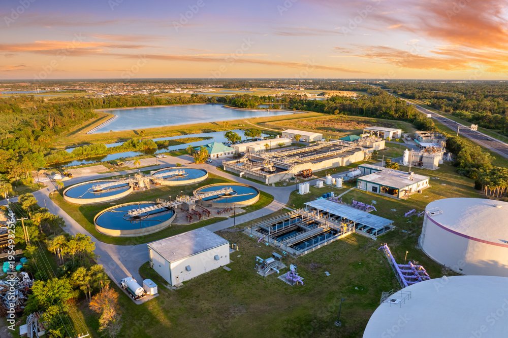 Aerial view of a water treatment facility at sunset